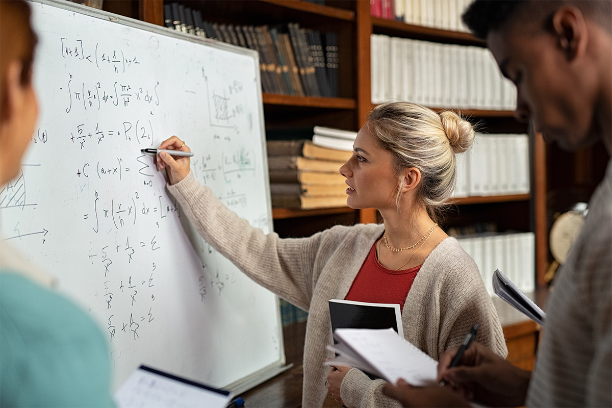 Photograph of students practicing mathematics