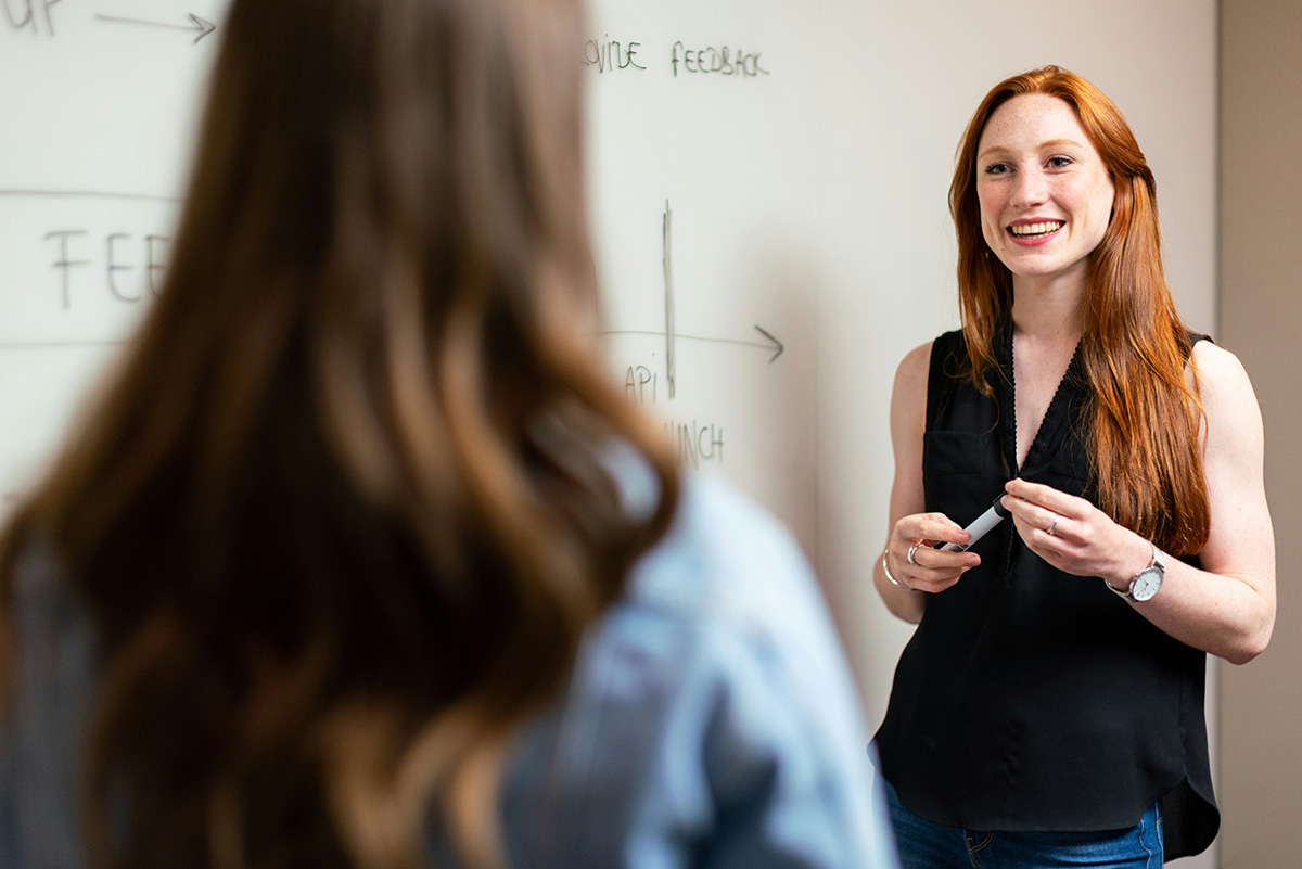 Photograph of a teacher with a student